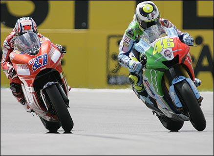 Valentino Rossi passes Australian Casey Stoner in the Dutch Grand Prix