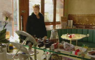 Gina finds the café trashed.