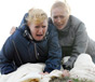 Gina and Eileen chucking Archie's body over a cliff