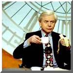 John Humphrys eats a banana on set