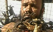 A man in a cage with crabs