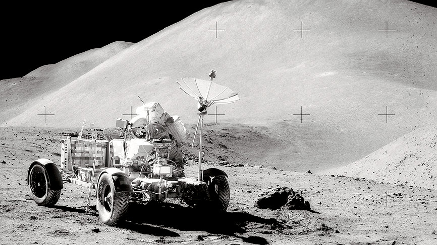 David R. Scott, Commander of Apollo 15, works at the Lunar Roving Vehicle
