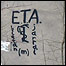 Grafite em muro na cidade basca de Llodio mostra a palavra Espanha como um alvo e a sigla do ETA