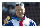 Chris Hoy shows off his gold medal