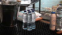 For this experiment you need a bucket, some mineral water bottles, salt, ice and water