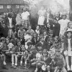A concert audience in the garden, Rotherham 1940's. Audrey holds her baby sister.(On the right) A concert audience in the garden, Rotherham 1940's. Audrey holds her baby sister.(On the right)