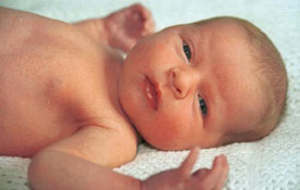 Baby in cot