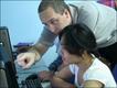 Trainer David Giles helps Joy to get to grips with email