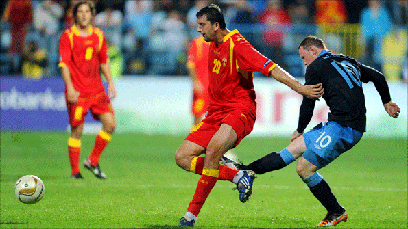 Wayne Rooney kicks out at Montenegro's Miodrag Dzudovic and is sent off