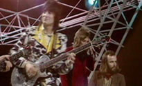 John “playing” Mandolin on Maggie May with the Faces