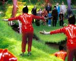 The Oompa-Loompas greet Willy Wonka