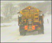 Grit spreader