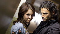 Lia (Lacey Turner) reveals a dark secret to Mitchell (Aidan Turner)
