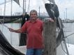 Pete Vela, a Croatian fisherman next to boat filled with ice, about to sail out and try his luck fishing in Port Sulphur. 