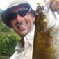 Darryl has been a keen fisherman since he was 5 years old. In this snap he is holding a Small Mouth Bass, taken on New River, Virginia 2007