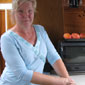 Sheelagh onboard the Rosy Rufu in the kitchen
