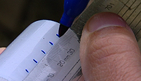 Yan marks is canisters to help his experiment.