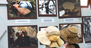 Two women look at photographs showing My Lai massacre