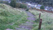 Veer left and walk down the concrete steps to the street below.