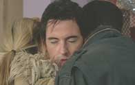 Scott hugs Cormac and Jo
