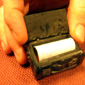 The little box containing the photograph and note from the story