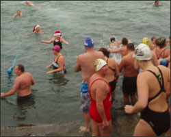 Swimmers entering the water at Harve des Pas