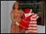 A lady holding old bathing costumes